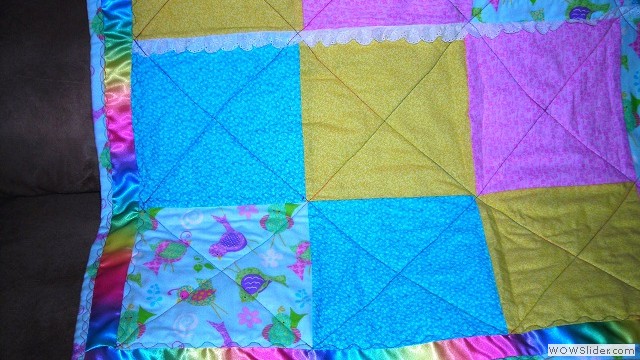 Colorful baby blanket close up view
